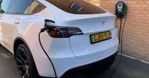 Zappi EV charger plugged into a white tesla